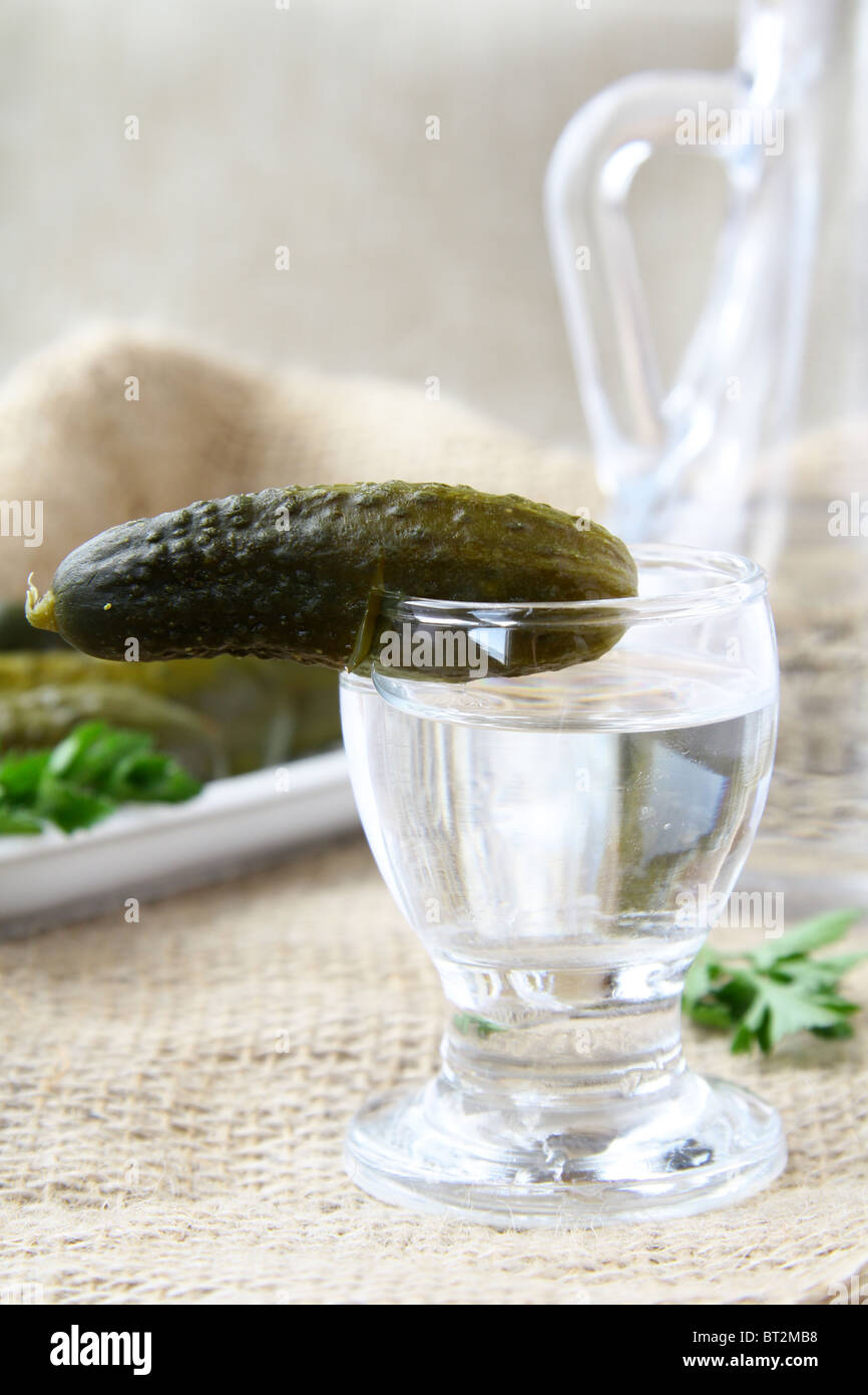 Russian vodka with pickles parsley and bottle Stock Photo