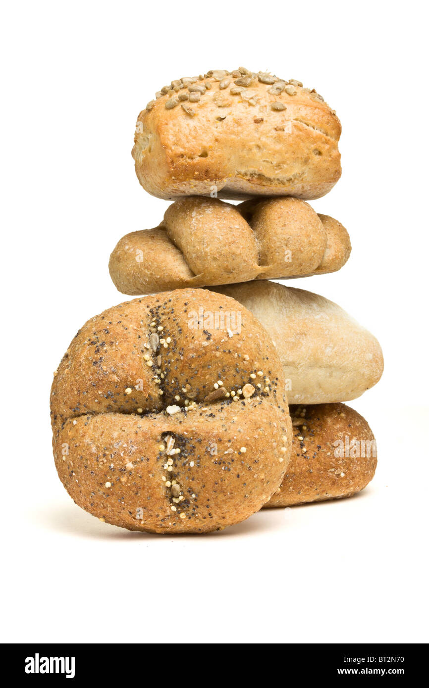 Abstract tower of handmade bread rolls from low perspective isolated against white. Stock Photo