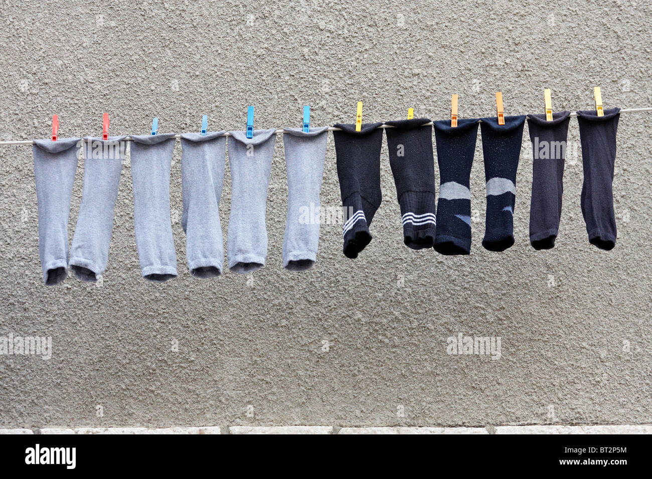 socks drying on a string Stock Photo - Alamy