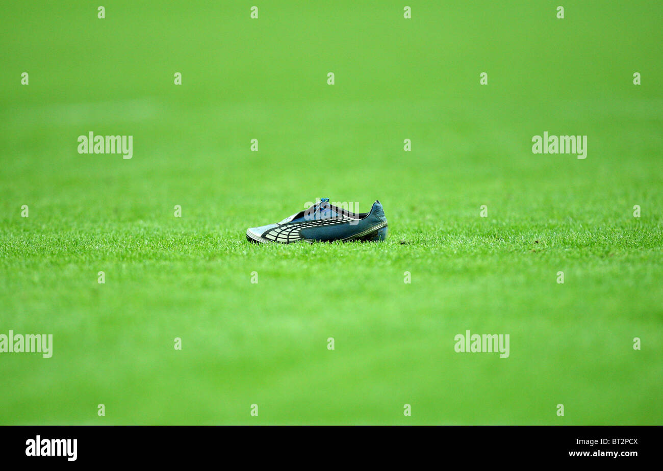 Shoe lost by a player on the pitch during the Heineken Cup Rugby match Saracens v Leinster. Stock Photo