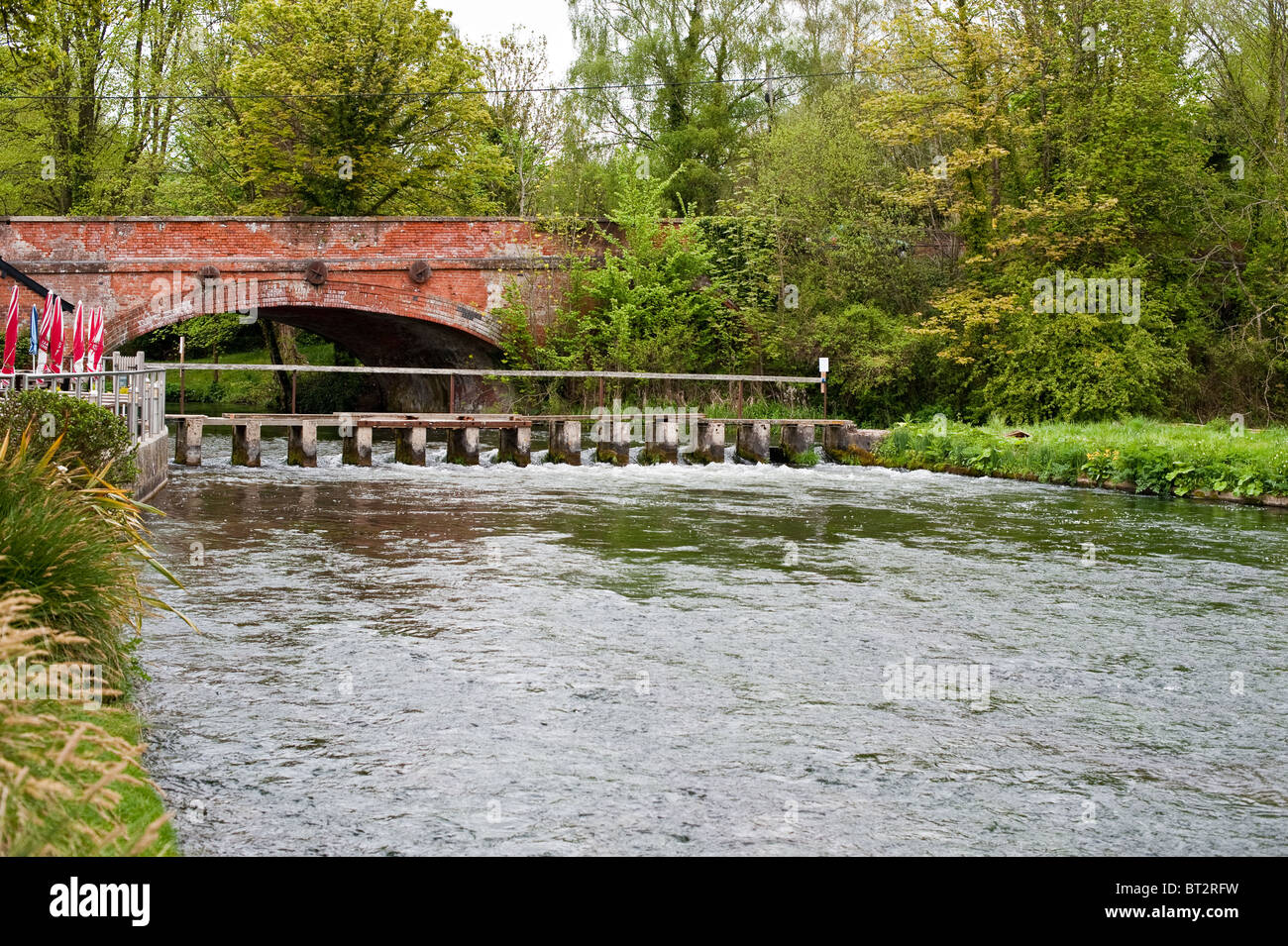 A bridge over the River Test in Hampshire. The River Test is a chalk stream famous for its excellent game fishing Stock Photo