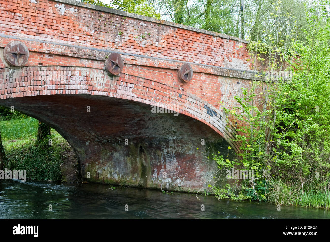 A bridge over the River Test in Hampshire. The River Test is a chalk stream famous for its excellent game fishing Stock Photo