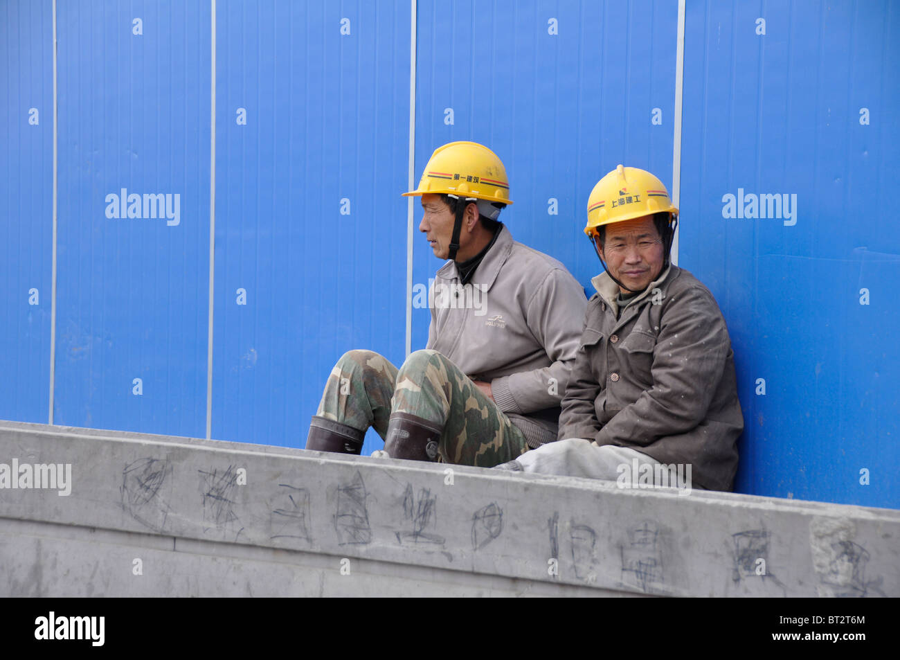 Two Migrant Construction Workers in Shanghai China Stock Photo