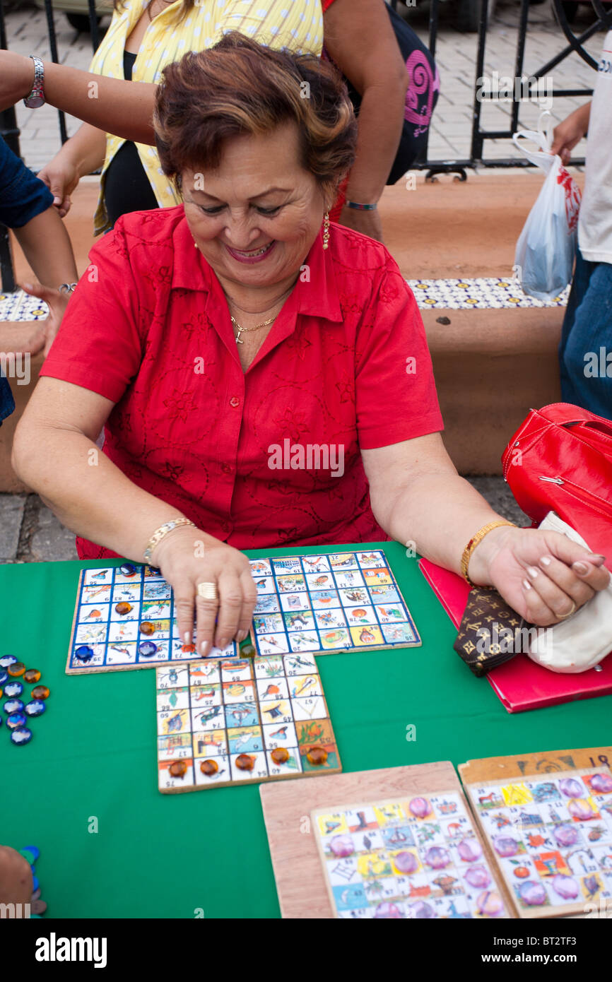 Woman playing bingo campechano during a fair in Campeche, Mexico Stock Photo