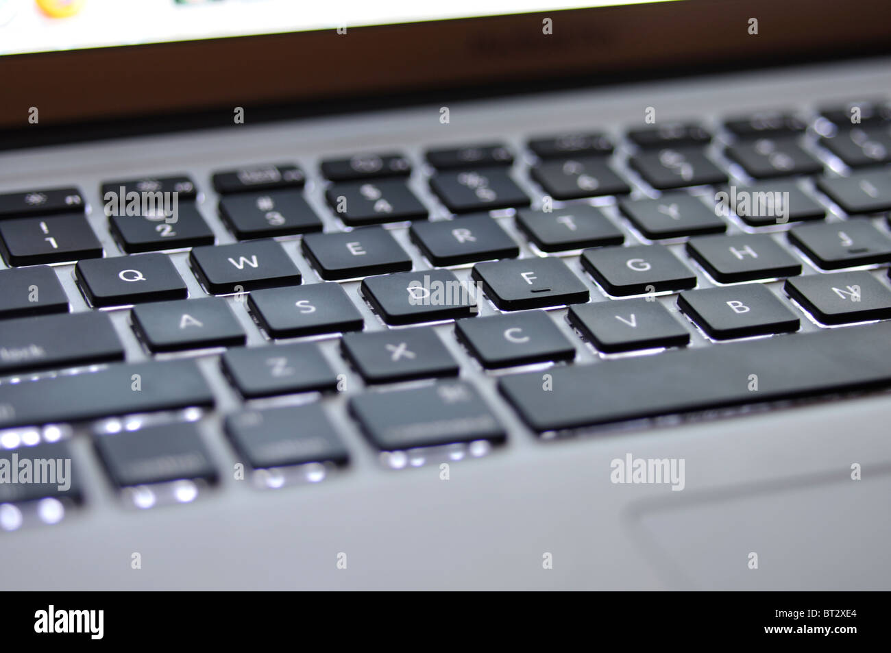 Apple Mac laptop lighted up keyboard Stock Photo Alamy