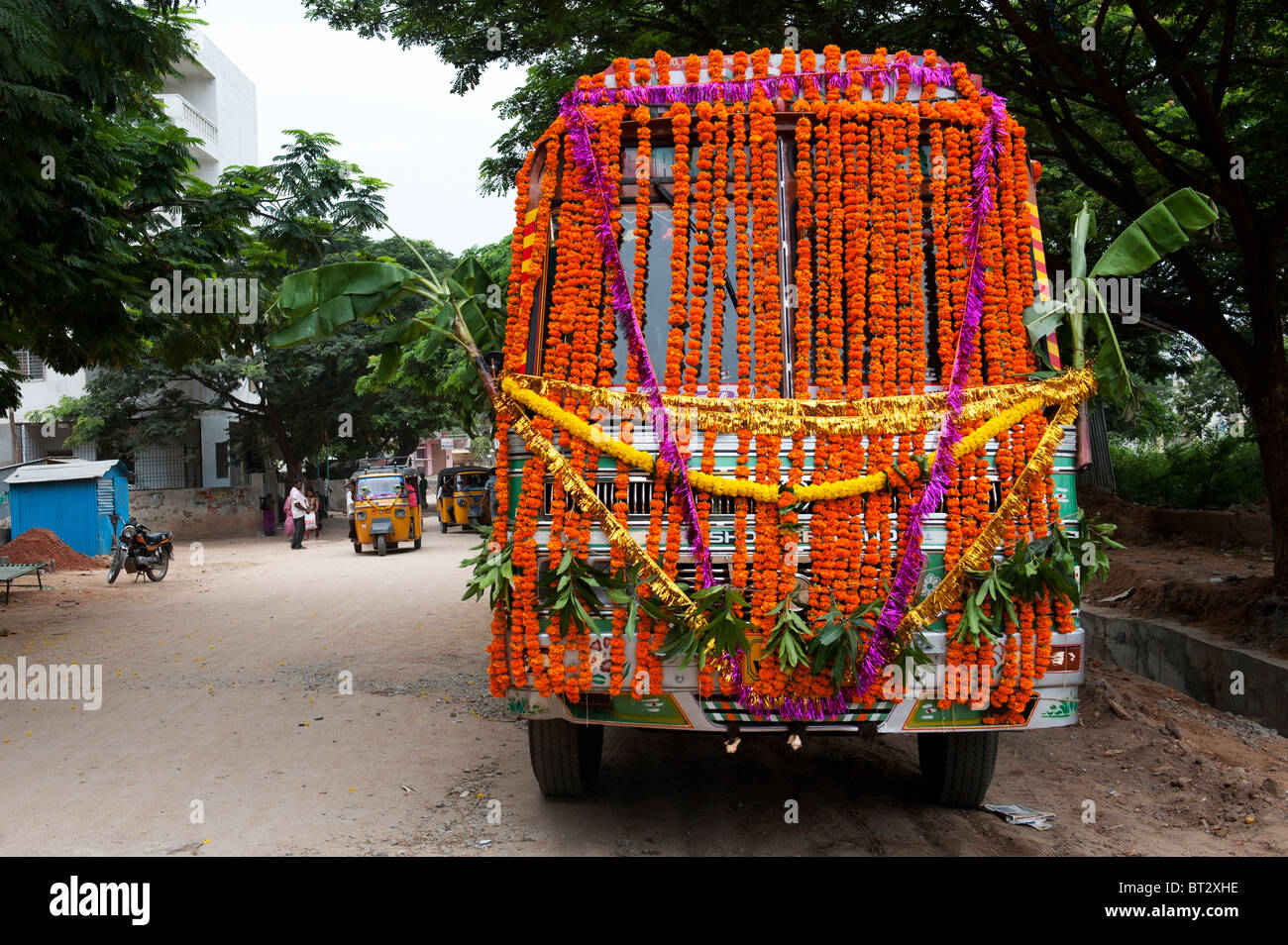 Indian lorry covered in flower garlands, prepared for Hindu Dasara
