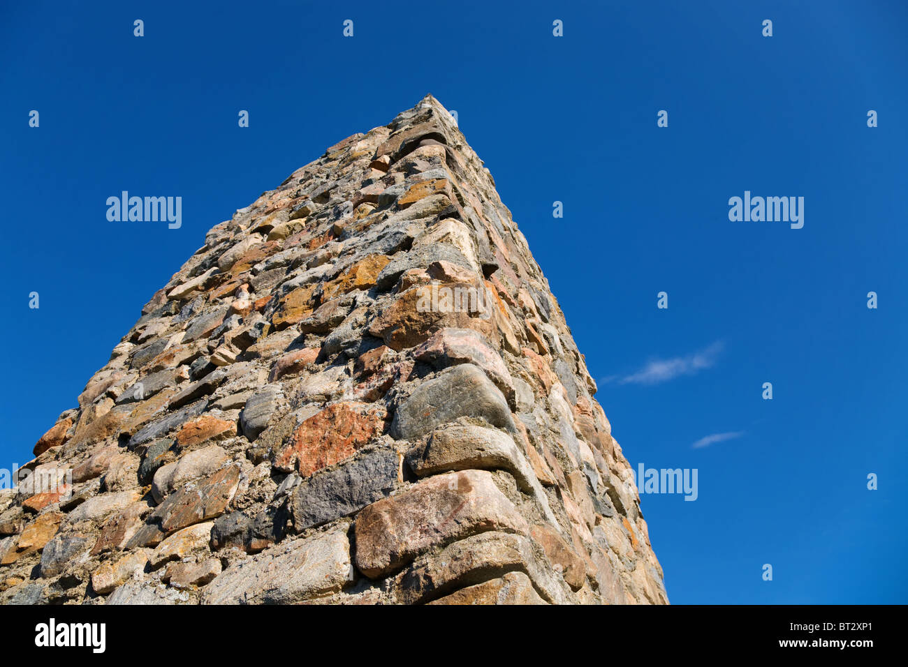 Stone column on a background of the blue sky Stock Photo - Alamy