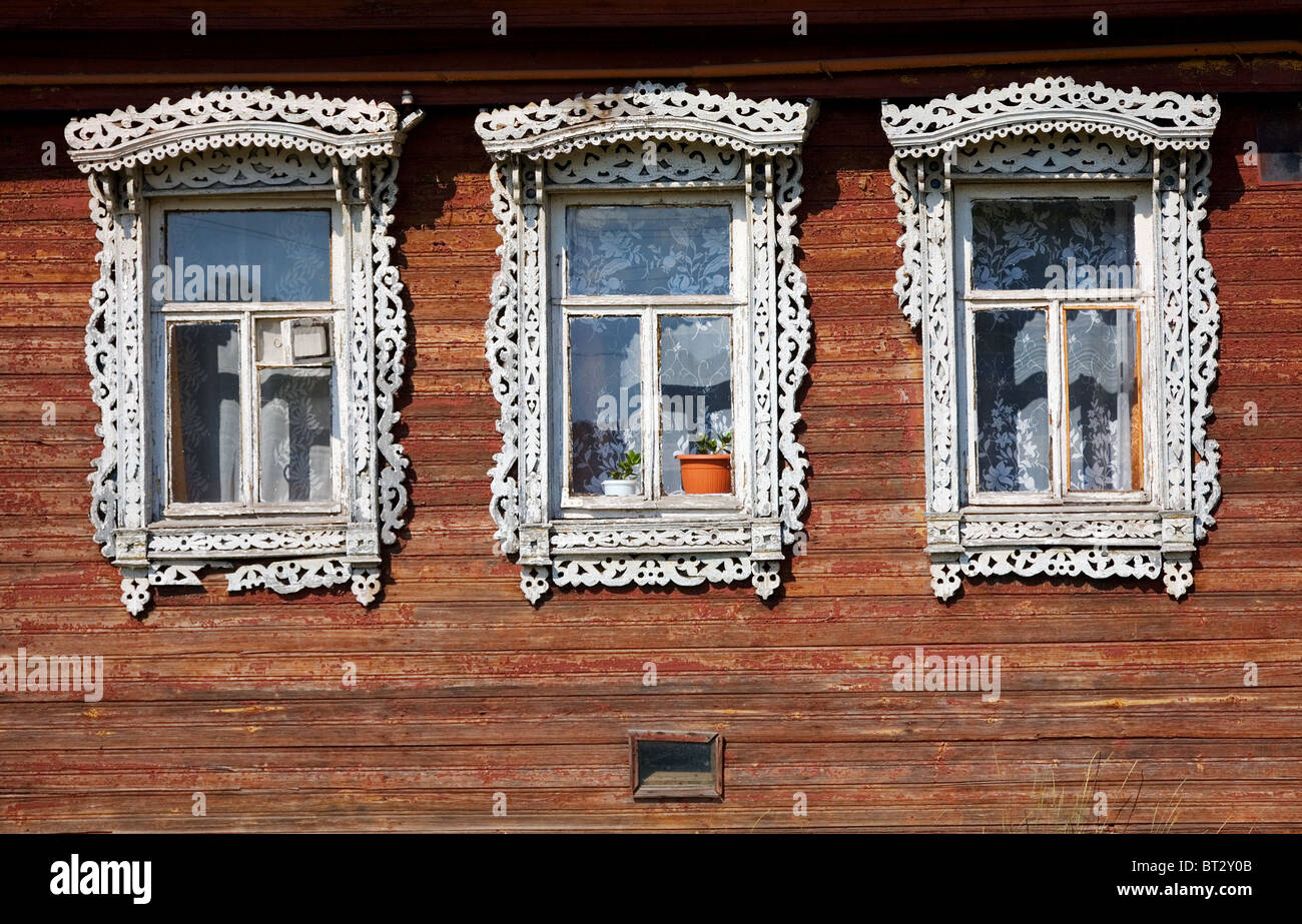 Three windows from old wooden rural wall Stock Photo - Alamy