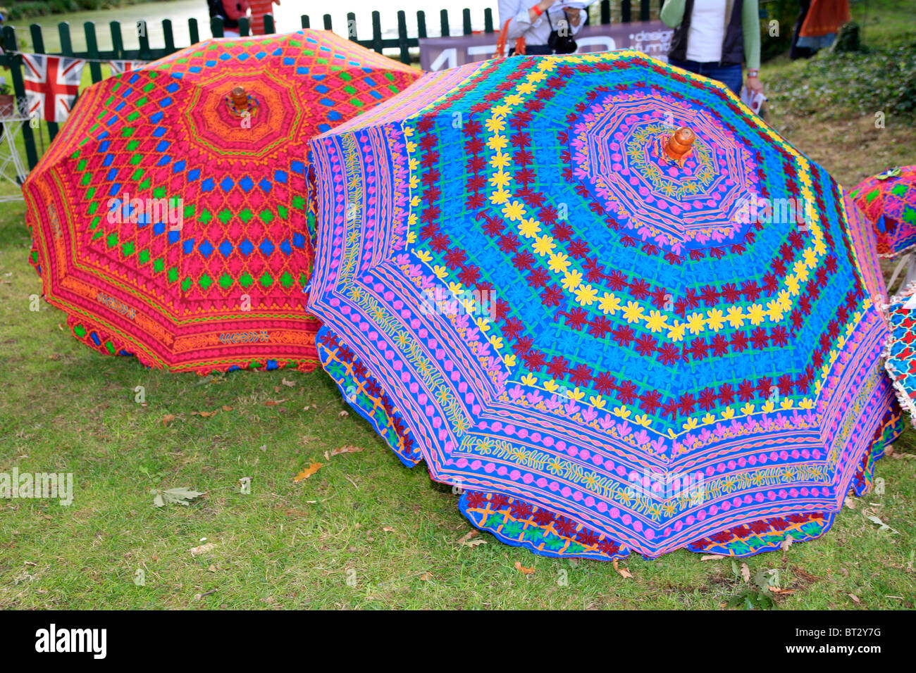Large handprinted cotton umbrellas for sale at an ecofair in Dorset