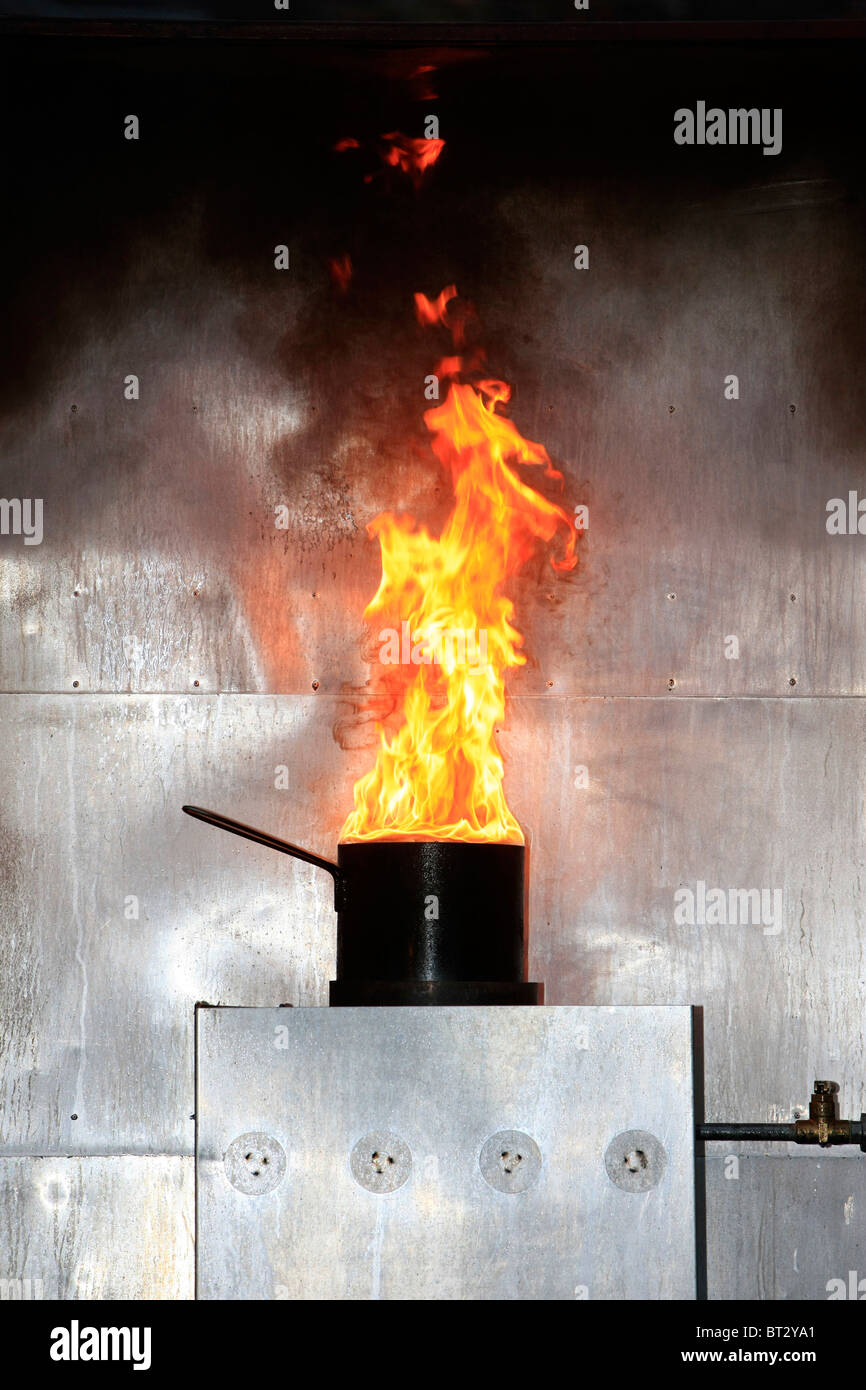 A simulated Chip (fries) pan fire with burning oil on a gas stove Stock Photo