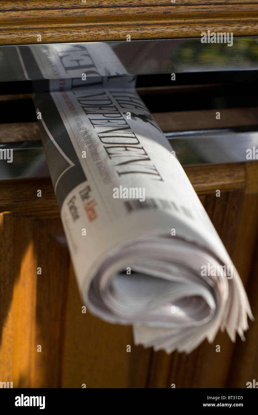 The independent newspaper in letterbox Stock Photo