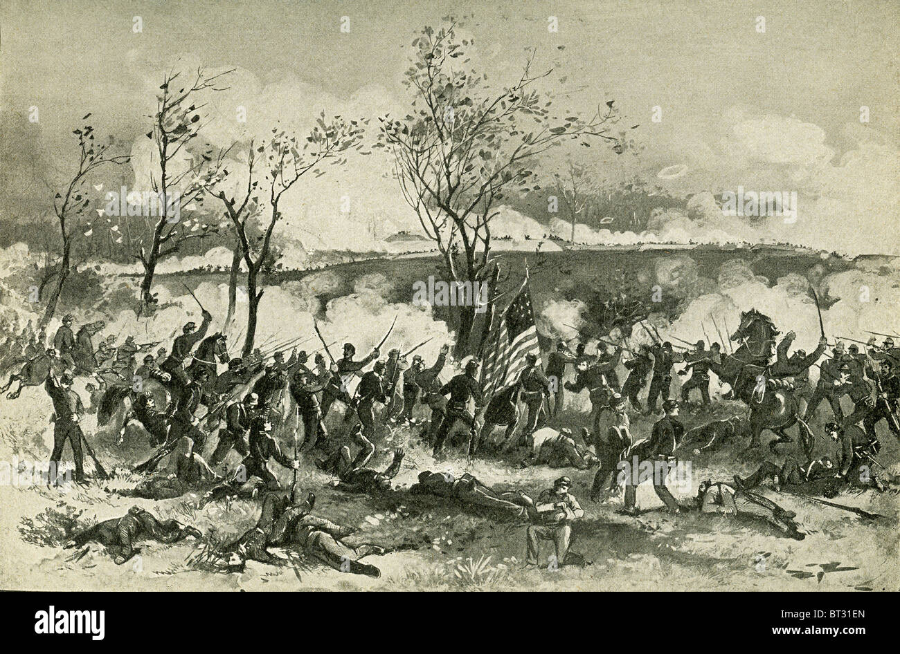 This 1898 illustration shows Union troops marching forward at Fort Donelson and attacking Confederates. Stock Photo