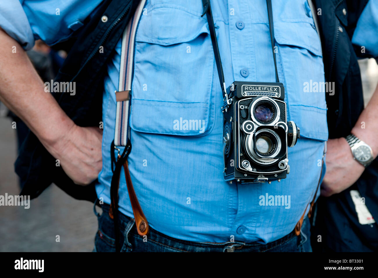 Twin lens Rolleiflex camera in use on male tourist in Rome, Italy. Stock Photo