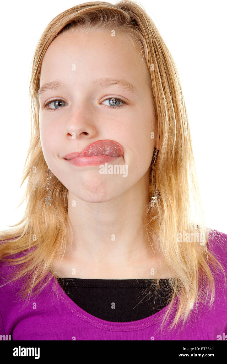 young girl makes funny face in closeup over white background Stock ...