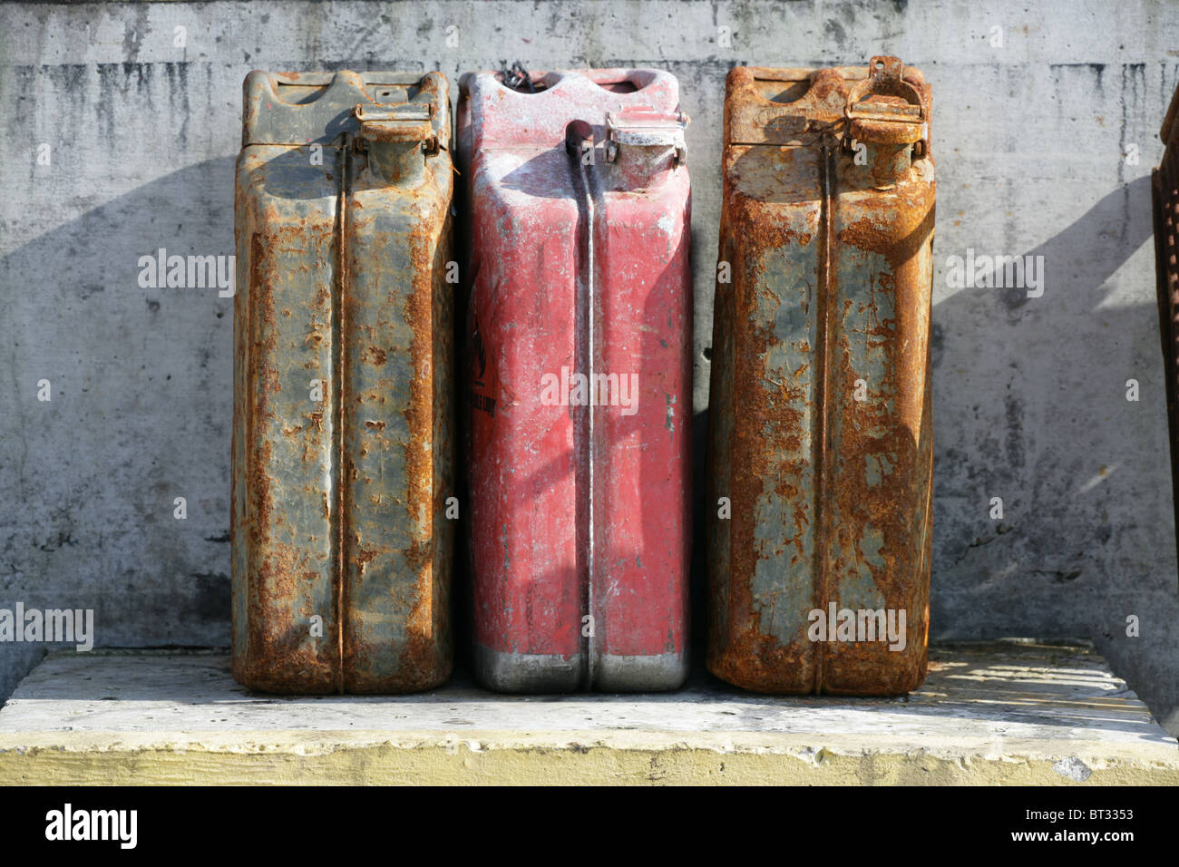 three rusty fuel tanks in harbour Stock Photo Alamy