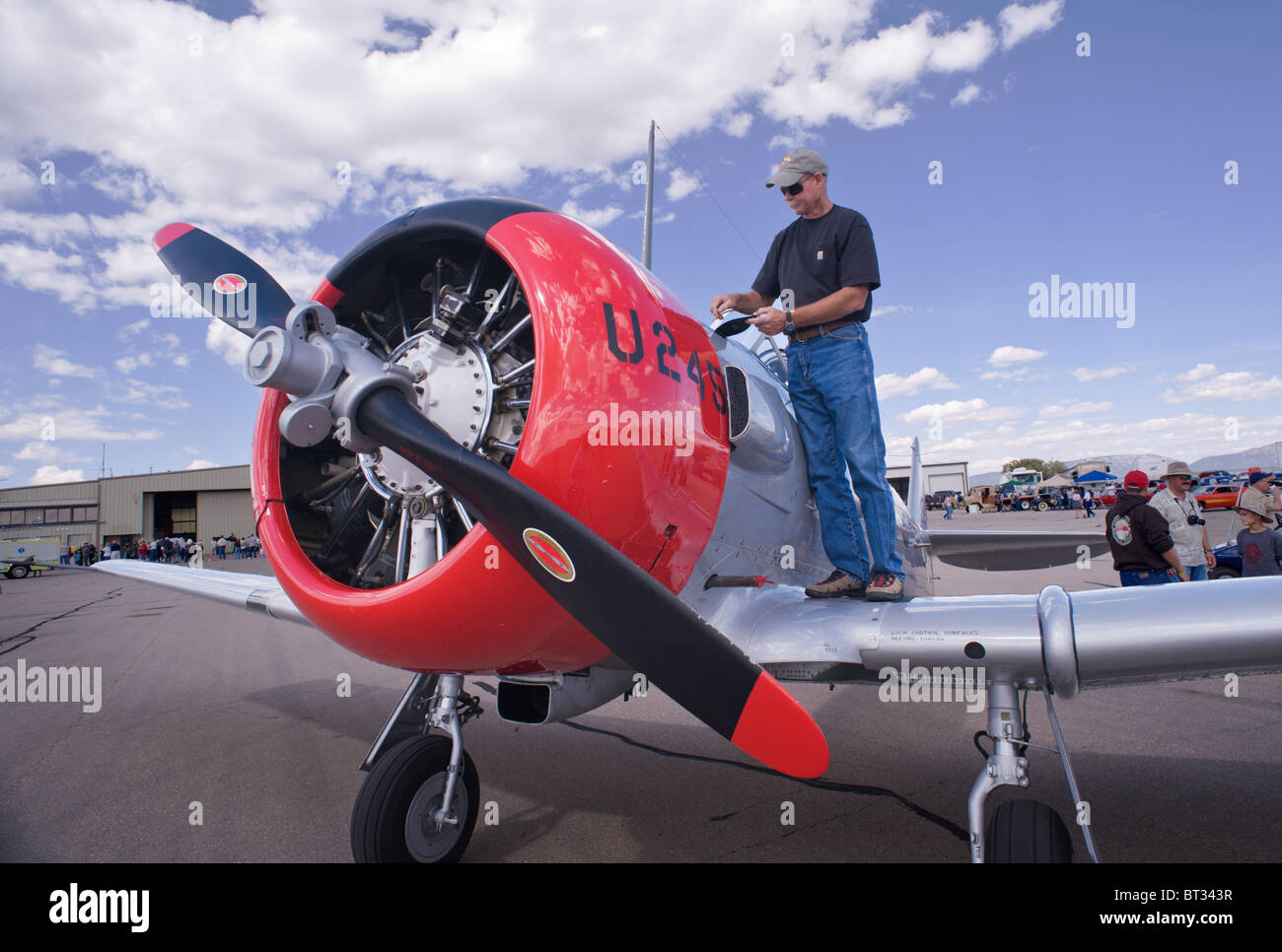 Pilot does a preflight inspection of his T6 aircraft , at the Ruidoso