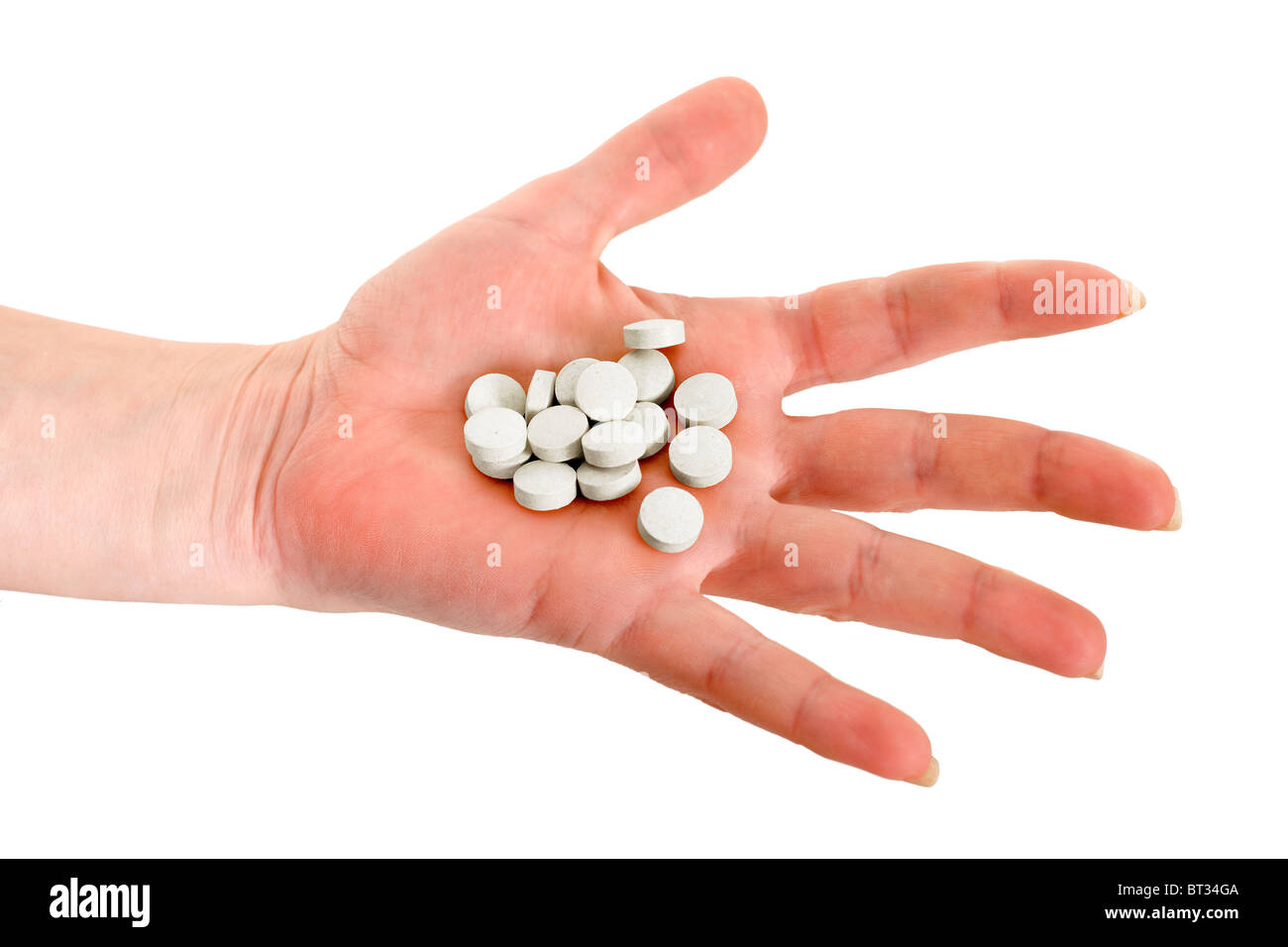 Handful of tablets on a female hand Stock Photo