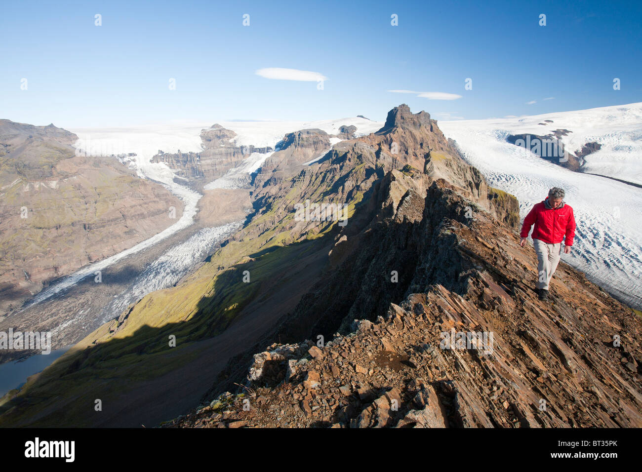 A mountaineer on the summit of Kristinartindar above Skaftafellsjokull