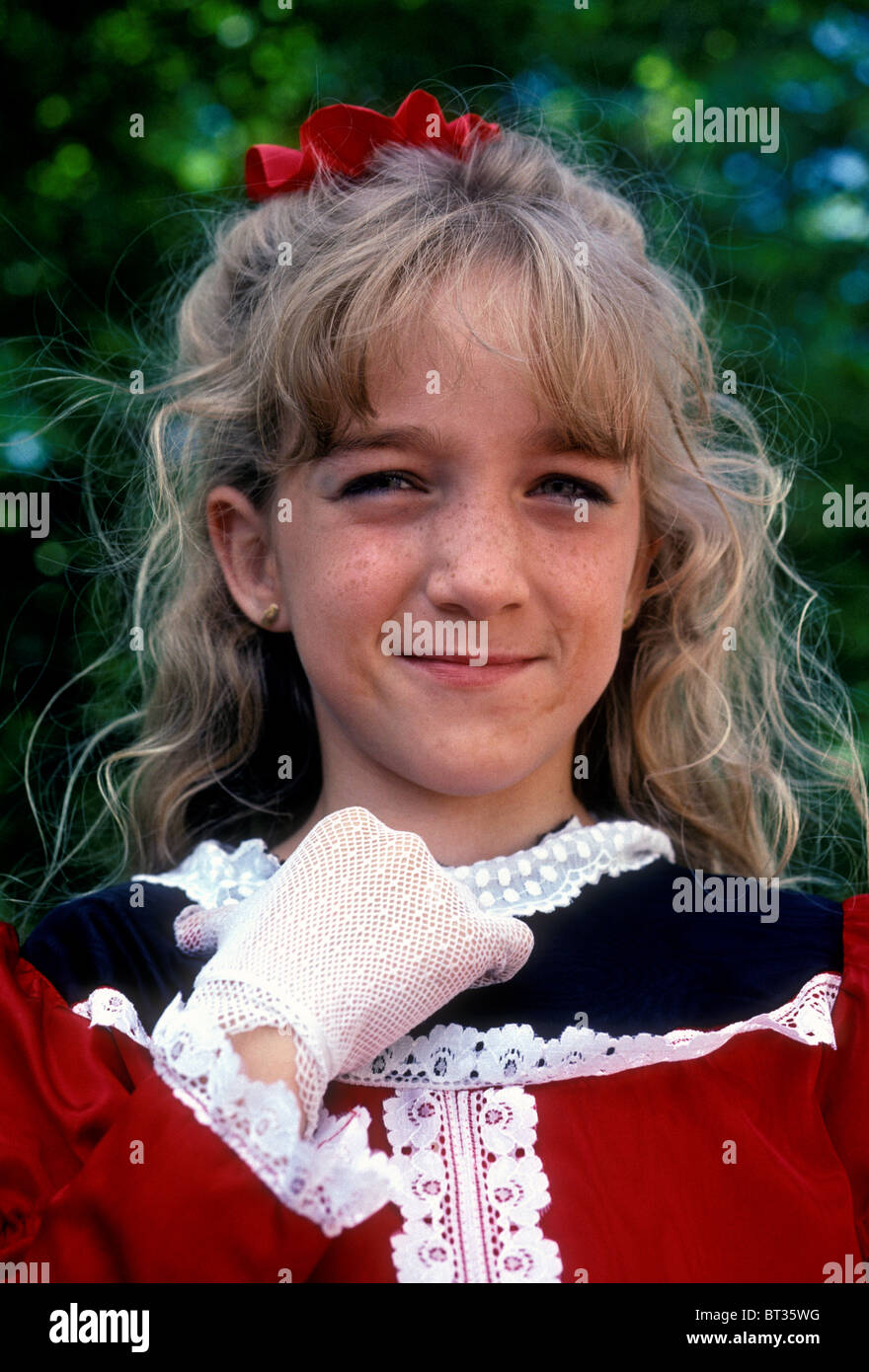 1, one, French girl, girl, child, eye contact, front view, portrait, wearing costume, Les Pennons de Lyon, festival, Lyon, Rhone-Alpes, France Stock Photo