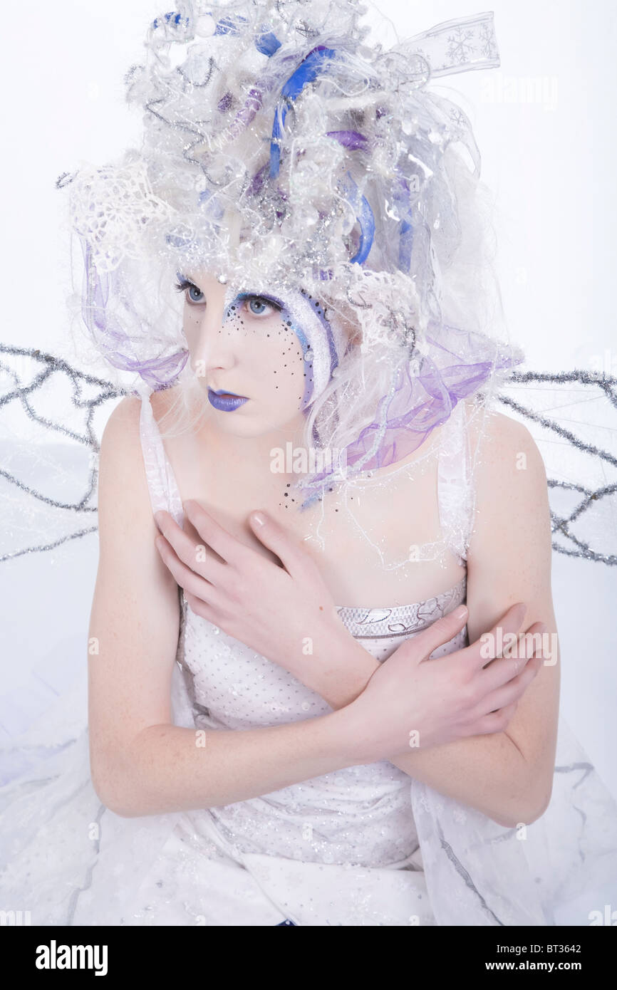 Woman with heavy stage makeup looking like a winter fairy. Stock Photo
