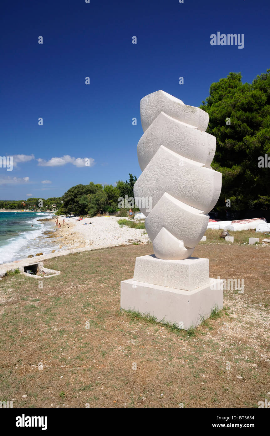 Public sculpture 'The Sails'  on seashore,  pebble beach in a background, Island Silba, Croatia Stock Photo
