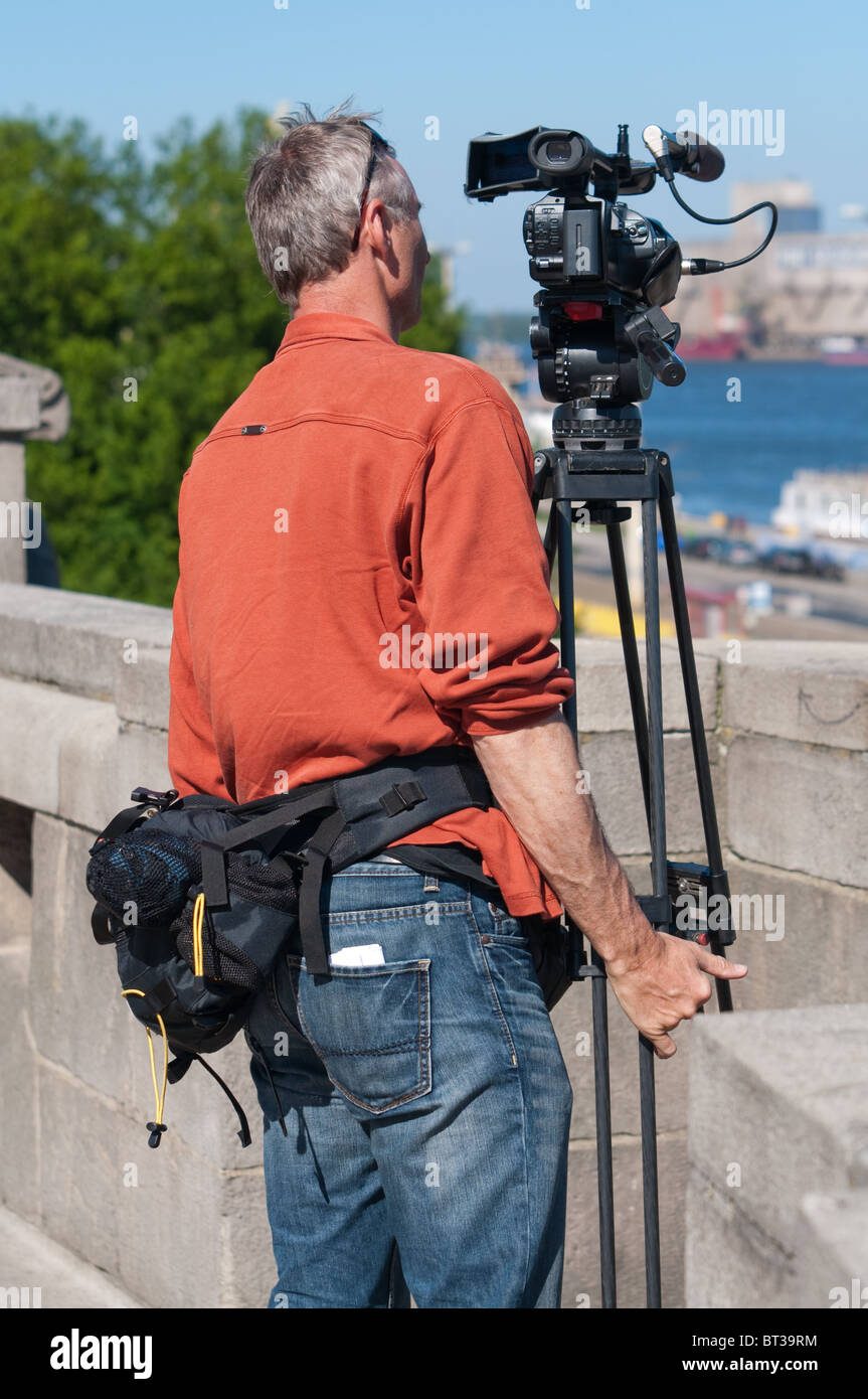 Video Camera Men man with the video camera Stock Photo - Alamy