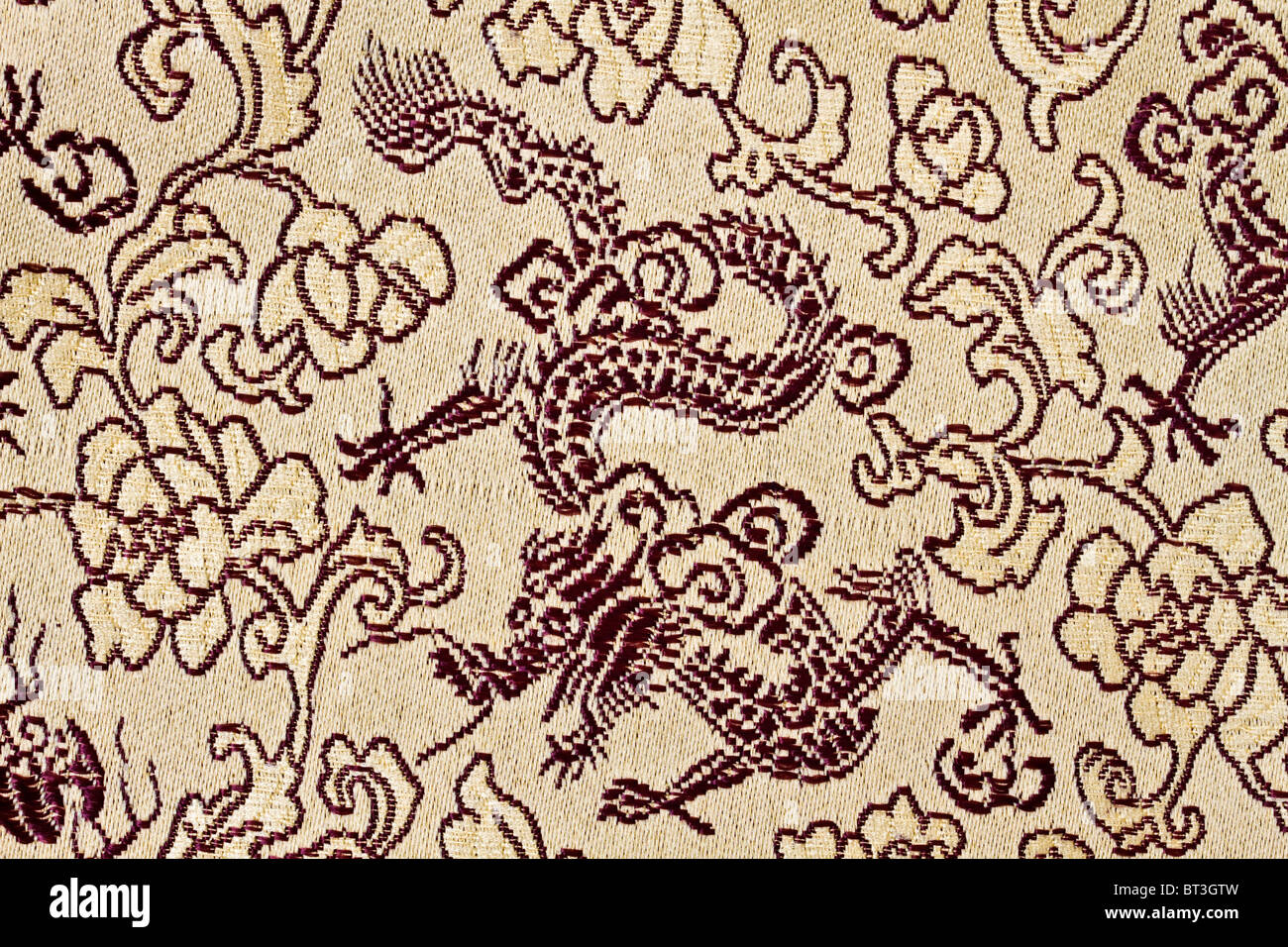 fabric texture of chinese golden dragons and flowers Stock Photo