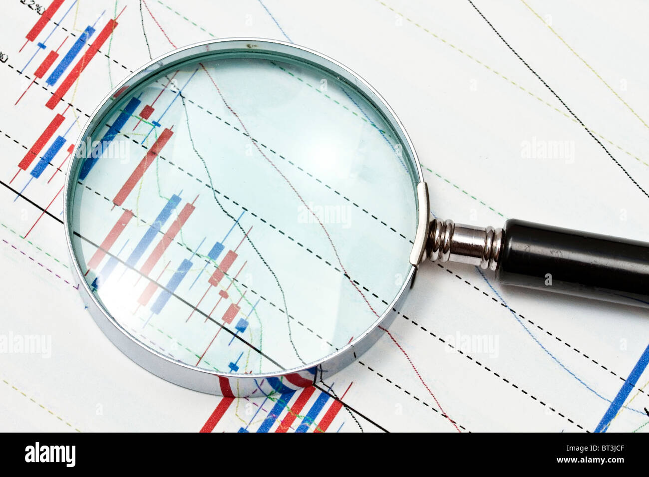 Background of business graph and a magnifier Stock Photo