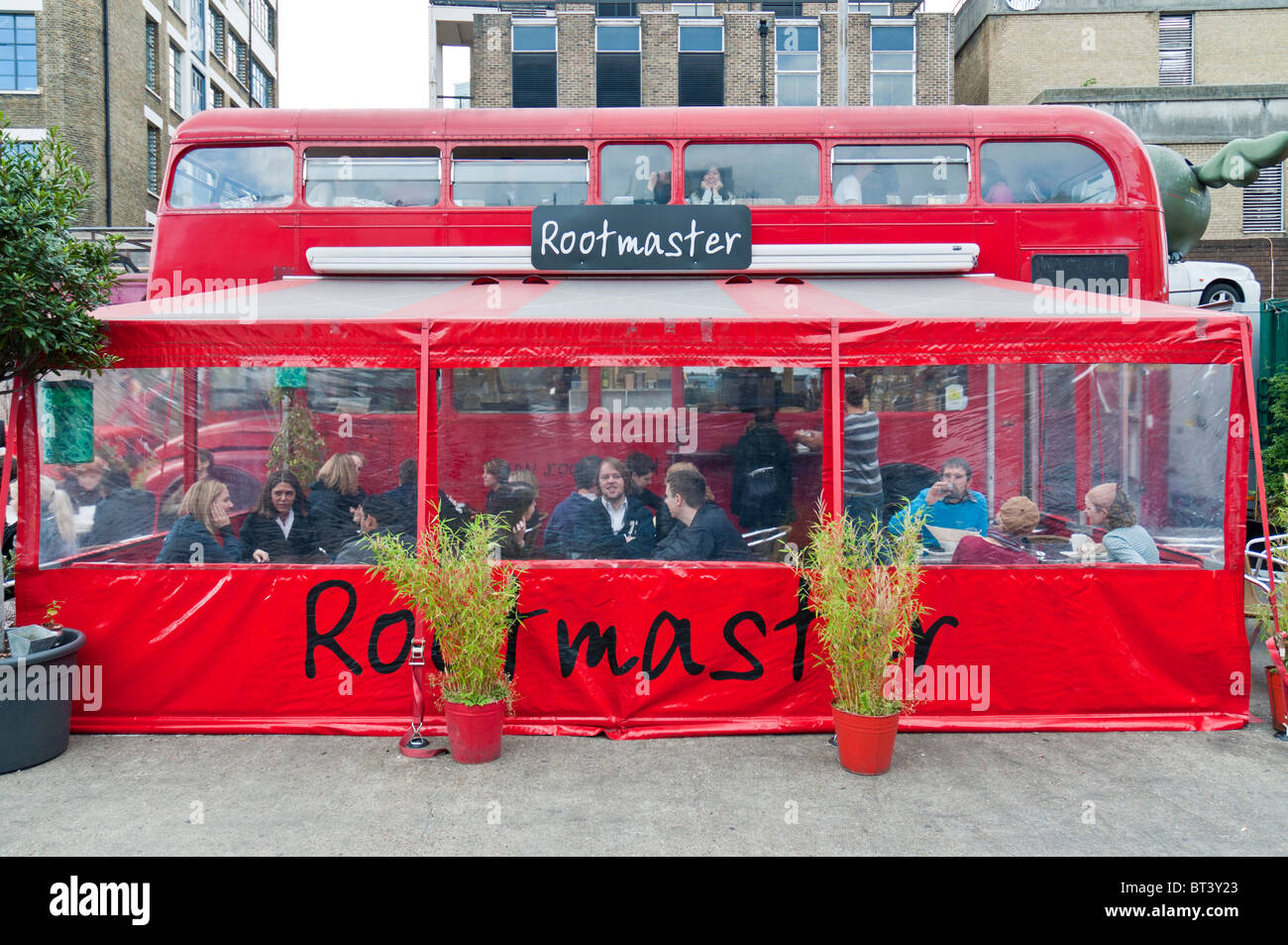 LONDON - OCTOBER 17: Restaurant built inside old double decker routemaster busin Bricklane market, which takes place every Sunda Stock Photo