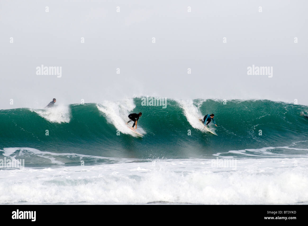 surfer surfing surf surfs up wave waves riding ride sea board surfboard surfboarding alantic rollers big roller of fuerteventura Stock Photo