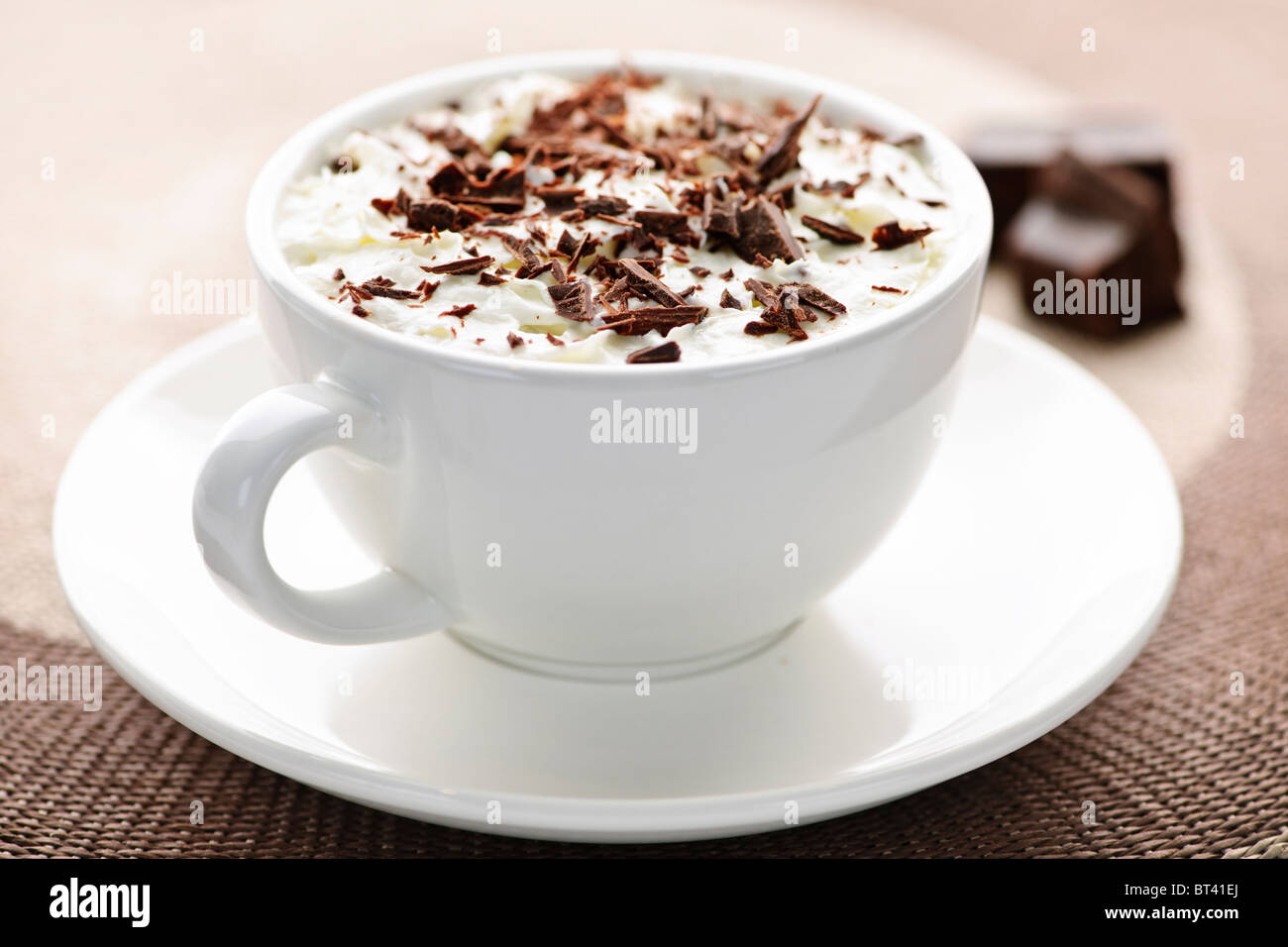Cup of hot cocoa with shaved chocolate and whipped cream Stock Photo