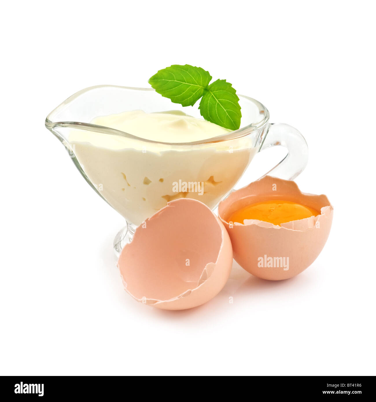 mayonnaise in bowl with broken egg Stock Photo