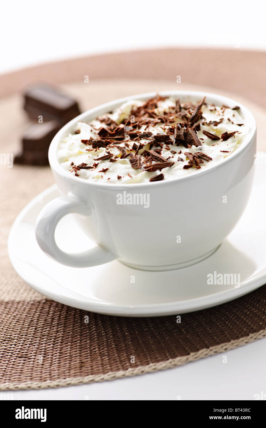 Cup of hot cocoa with shaved chocolate and whipped cream Stock Photo