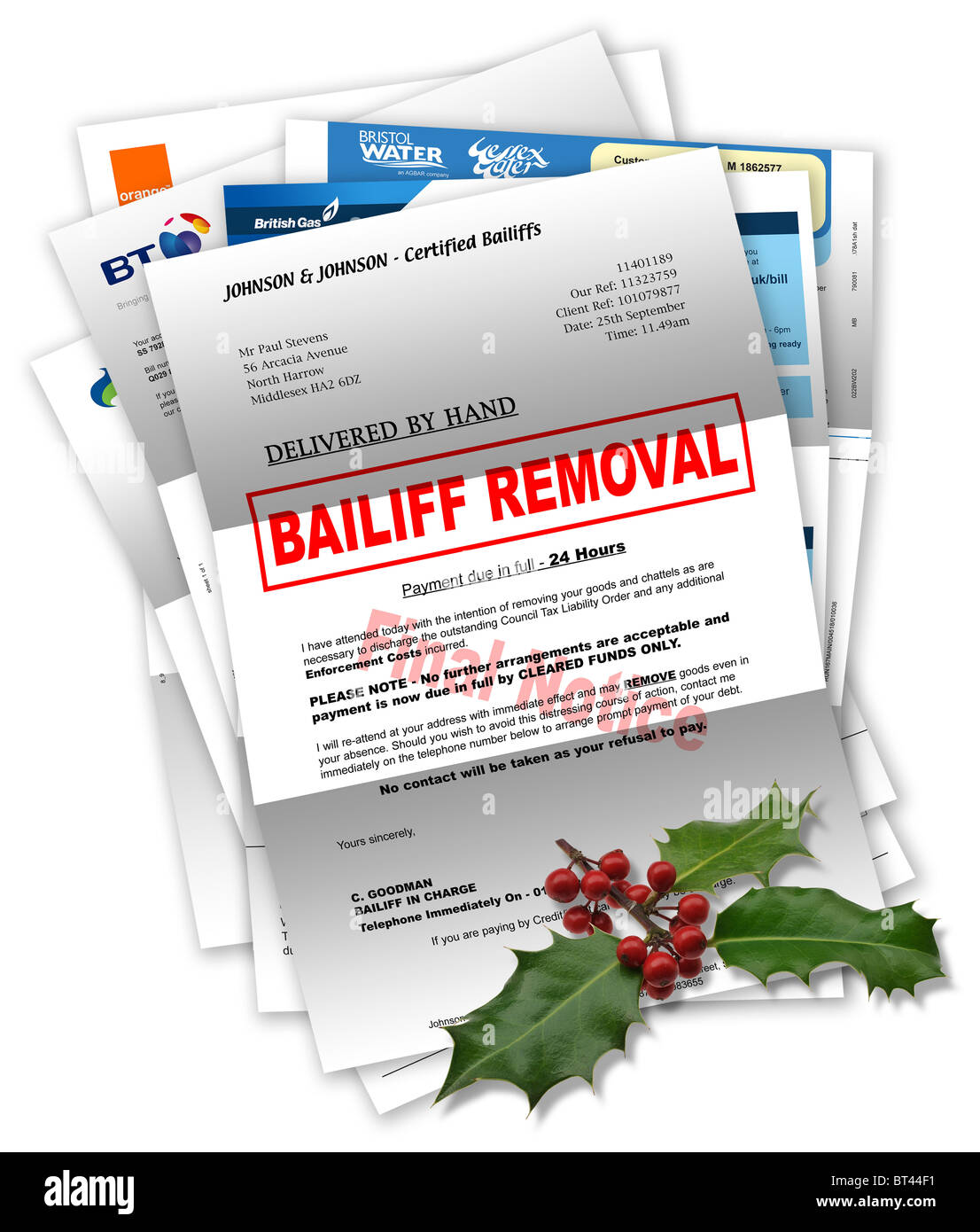 Bailiff Letter & Bills with Christmas holly on top Stock Photo