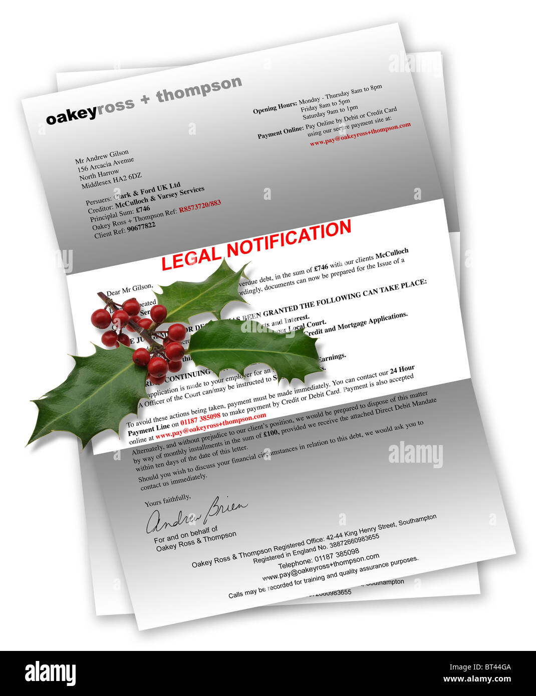 Legal Notification Letter for bad debt with Christmas holly on top Stock Photo