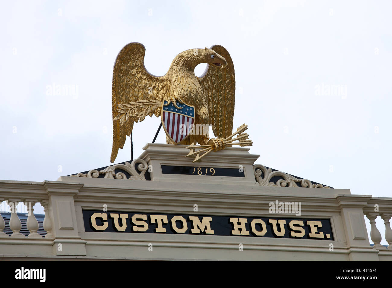 Golden eagle with American shield, arrows, and olive branch on top of the Custom House, Salem Stock Photo