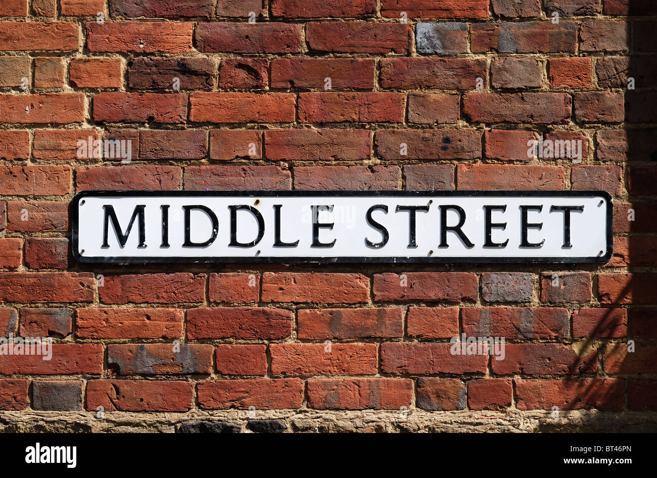 Road name sign for Middle Street on brick wall in Shere, Surrey, England Stock Photo