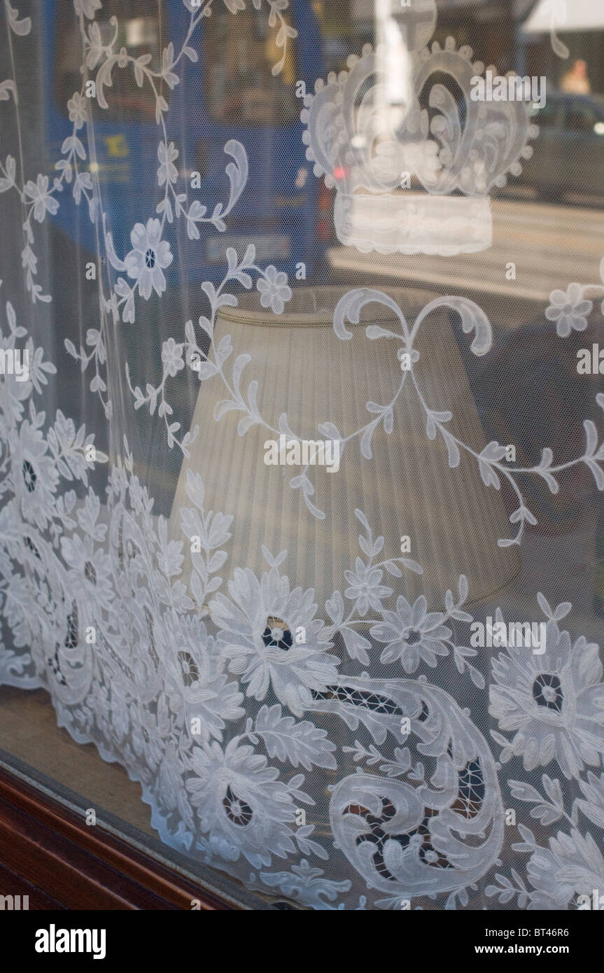 a lace curtain in a restaurant window in the old part of Zurich