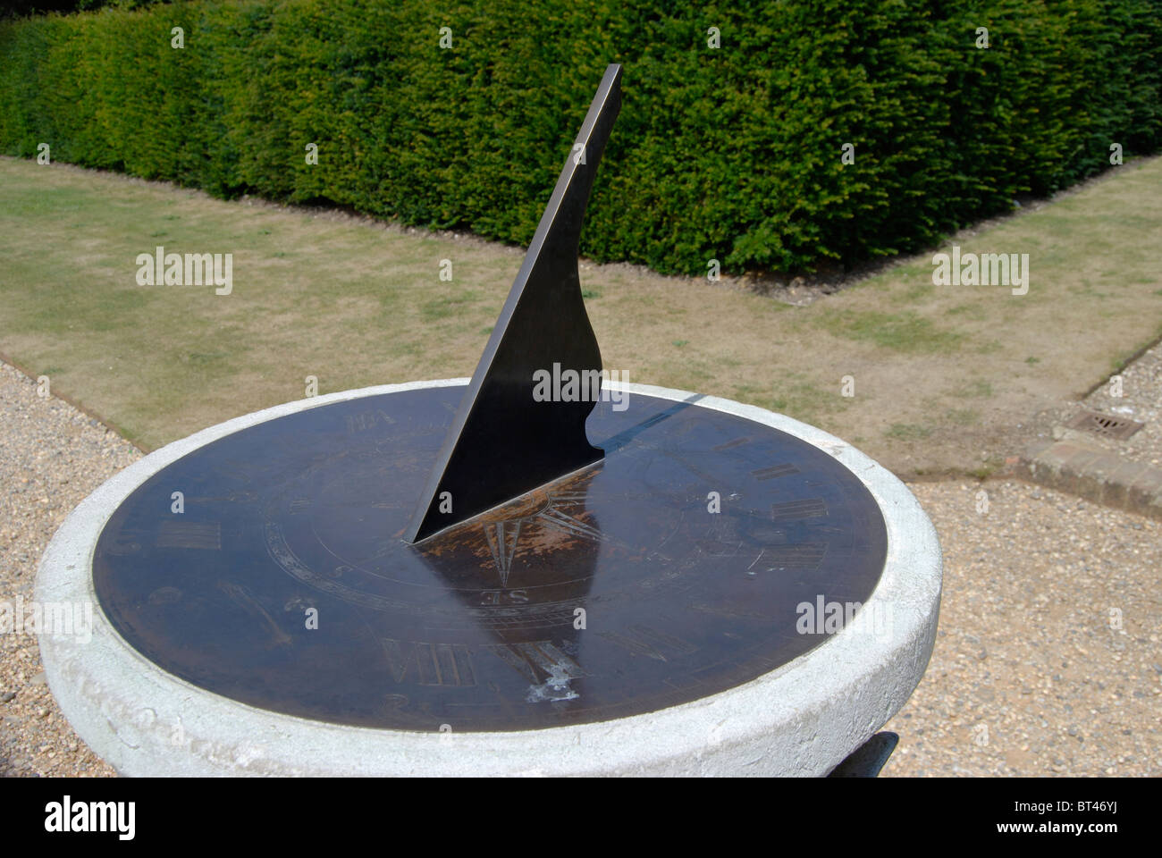 Sundial at midday in an English country garden. Surrey. England Stock