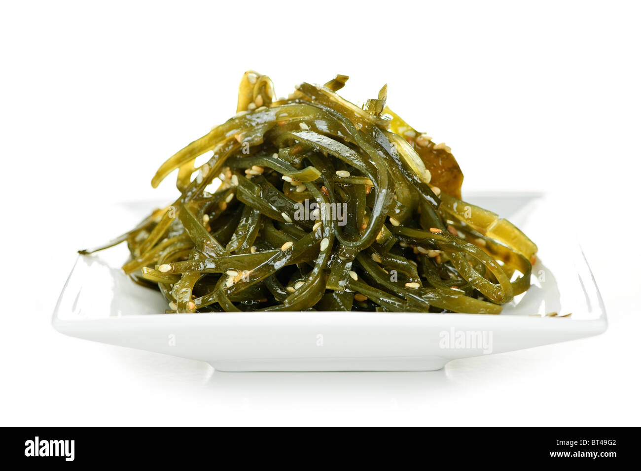 Plate of wakame seaweed salad on white background Stock Photo