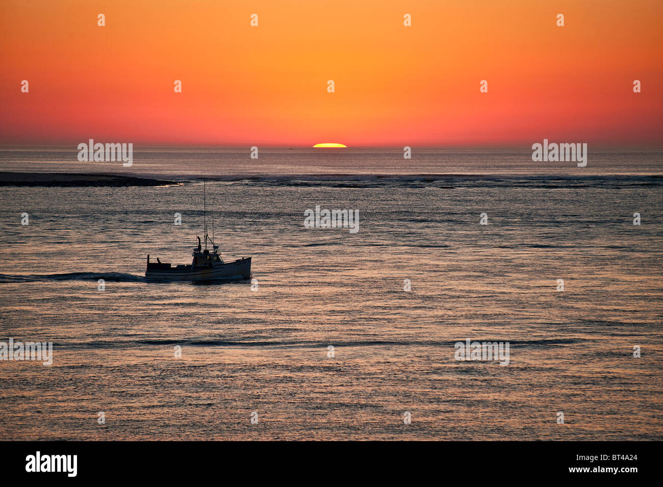 Fishing boat at sunrise, Chatham, Cape Cod, Massachusetts, USA Stock Photo