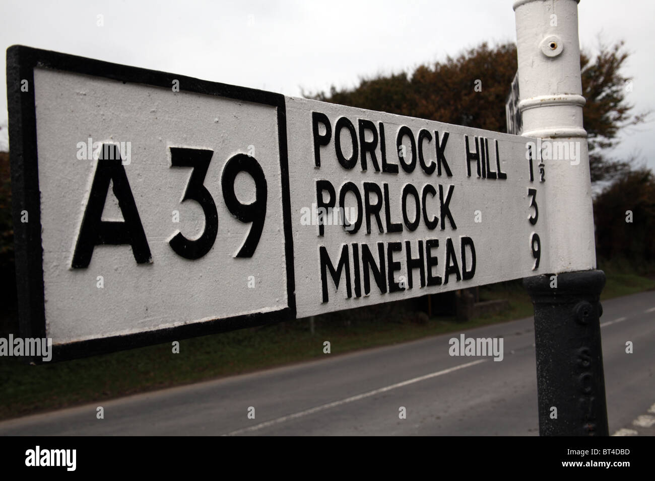 Old fashioned road direction sign, Porlock Hill, Somerset, England Stock Photo