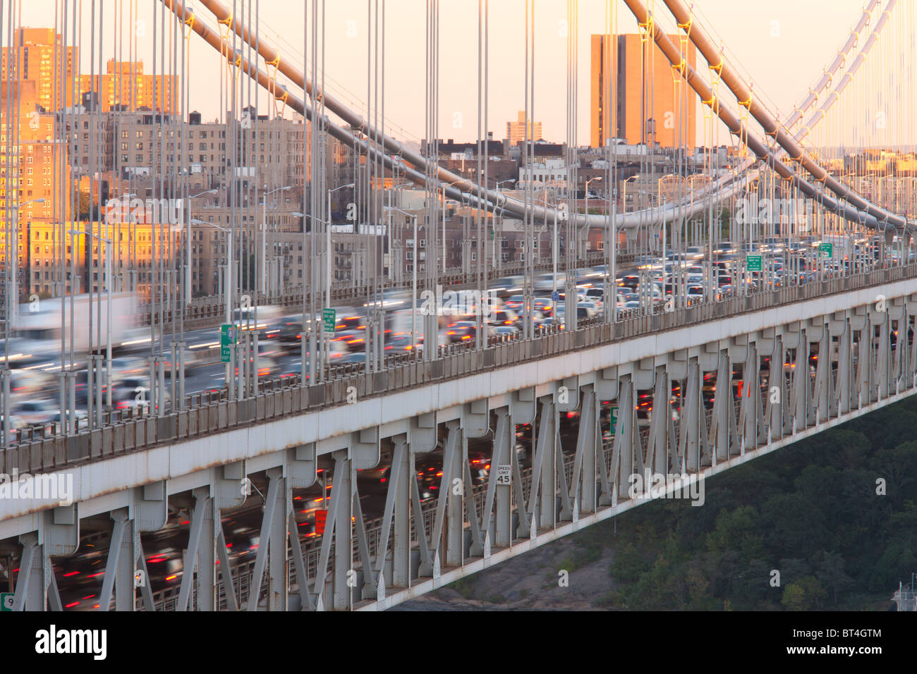 The George Washington Bridge and evening traffic crossing the Hudson River into Manhattan from New Jersey Stock Photo