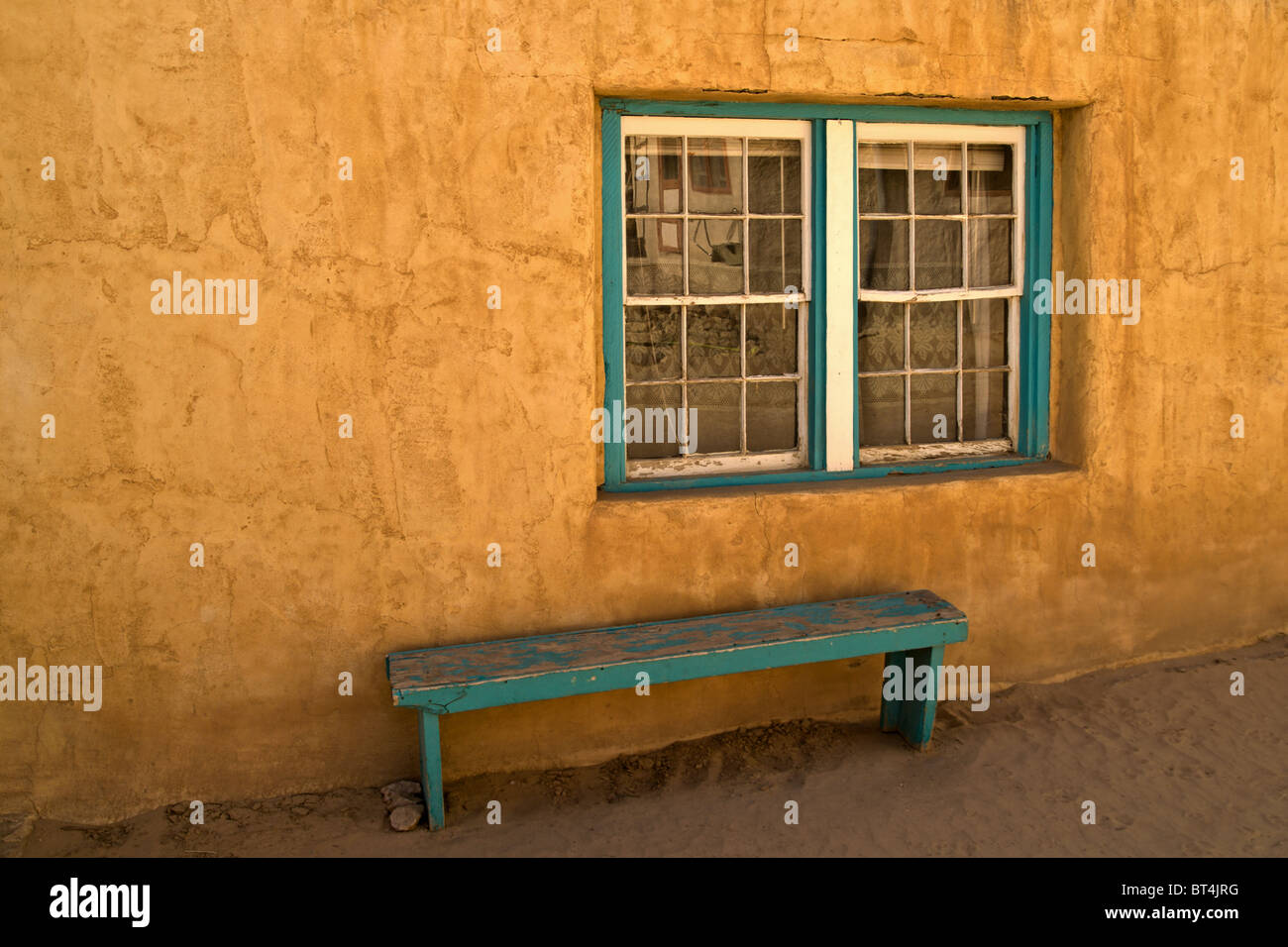 Bench and Window - Acoma Pueblo, New Mexico, USA Stock Photo