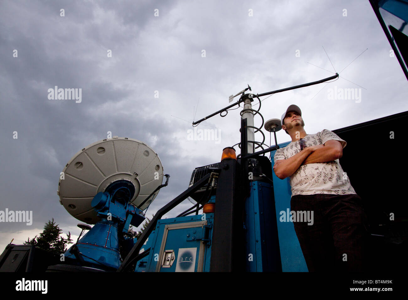 Scientist Justin Walker stands in front of Doppler on Wheels number 6