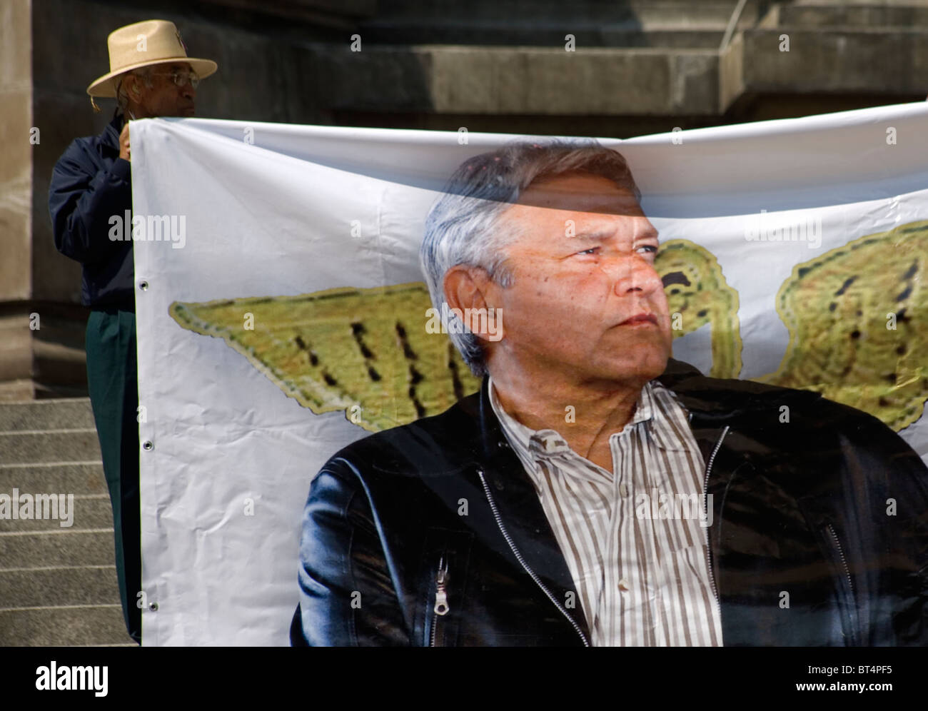 A protester holds a banner with the former presidential candidate Andres Manuel Lopez Obrador at a political meeting Stock Photo