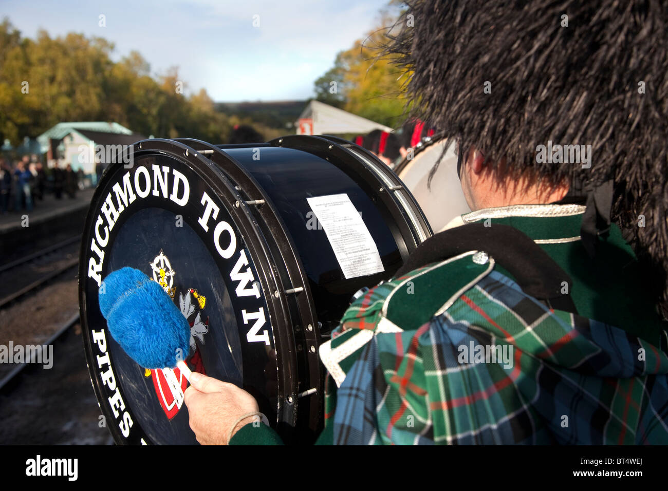 Richmond Town Scottish Pipe Band Drummer with programme of events and