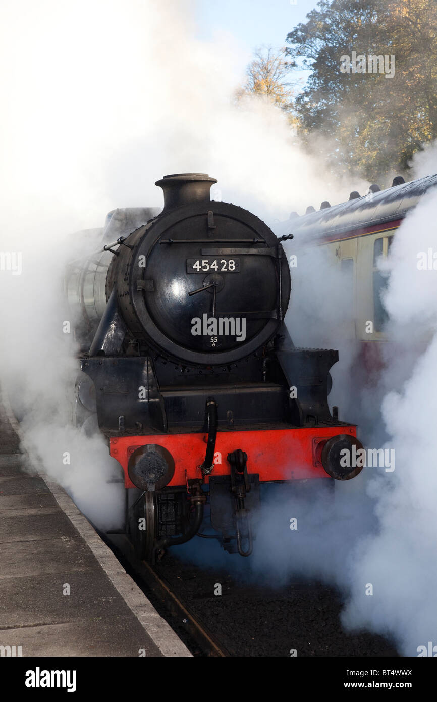 Making steam on uphill gradient. Restored Black 5 steam locomotive No. 45428 'Eric Treacy' at Grosmont Station, North Yorkshire, UK Stock Photo
