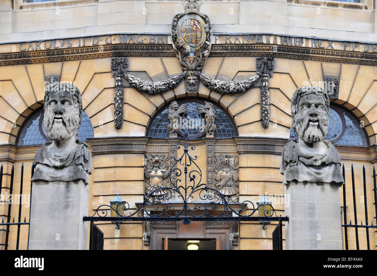 Gargoyles on railings outside the Sheldonian Theatre, Broad Street, Oxford Stock Photo
