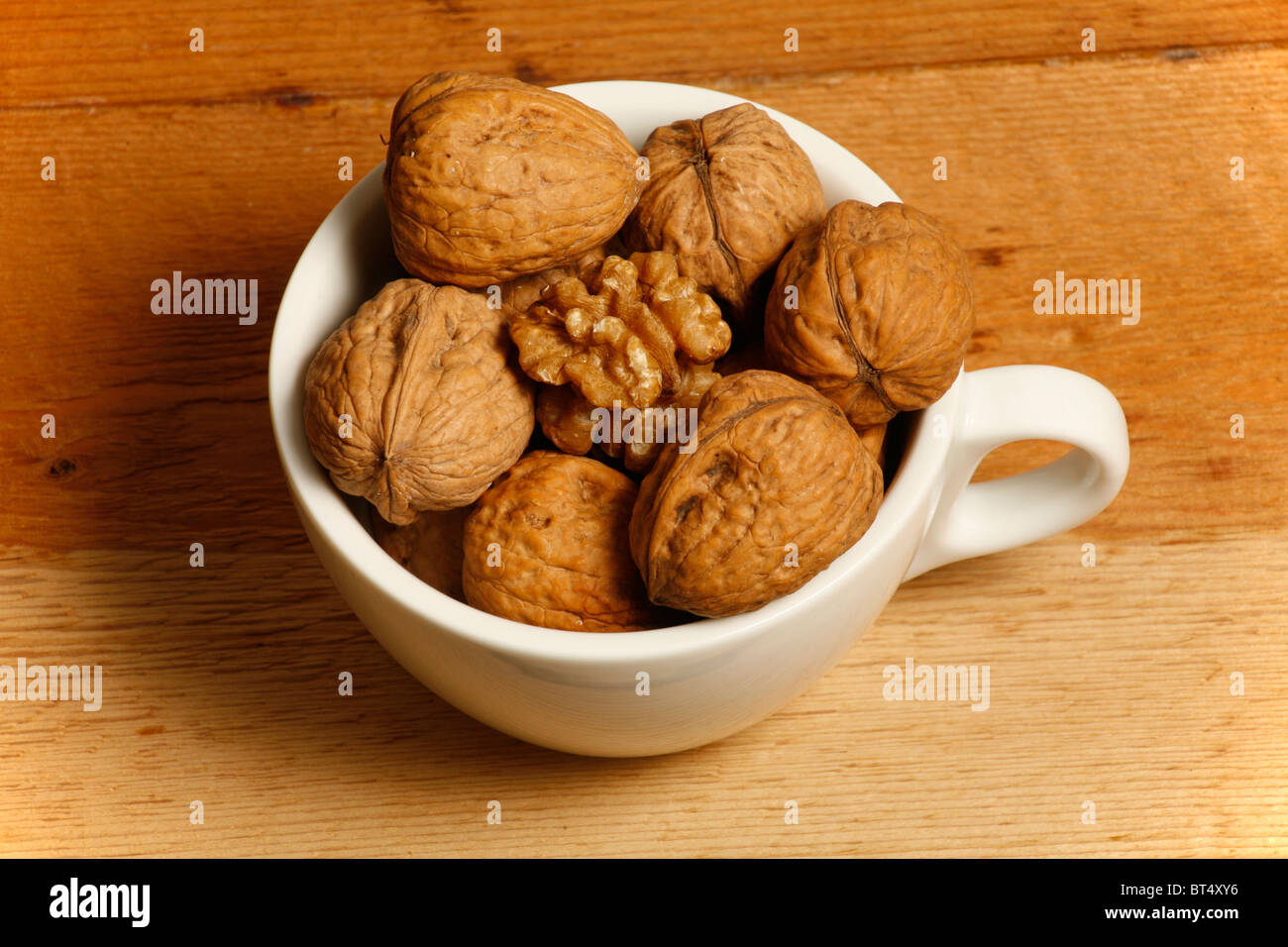 Walnuts in cup Stock Photo Alamy